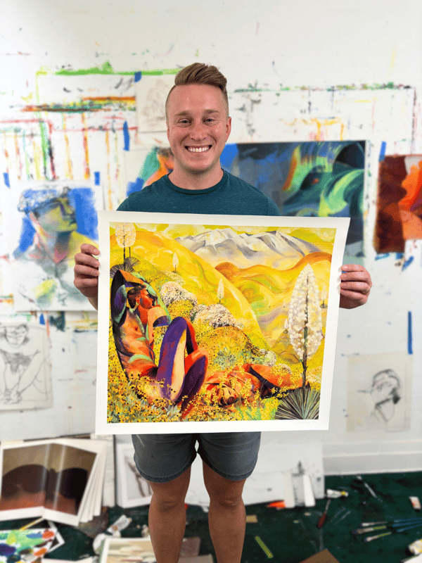J Carino holding print J Carino holding print
